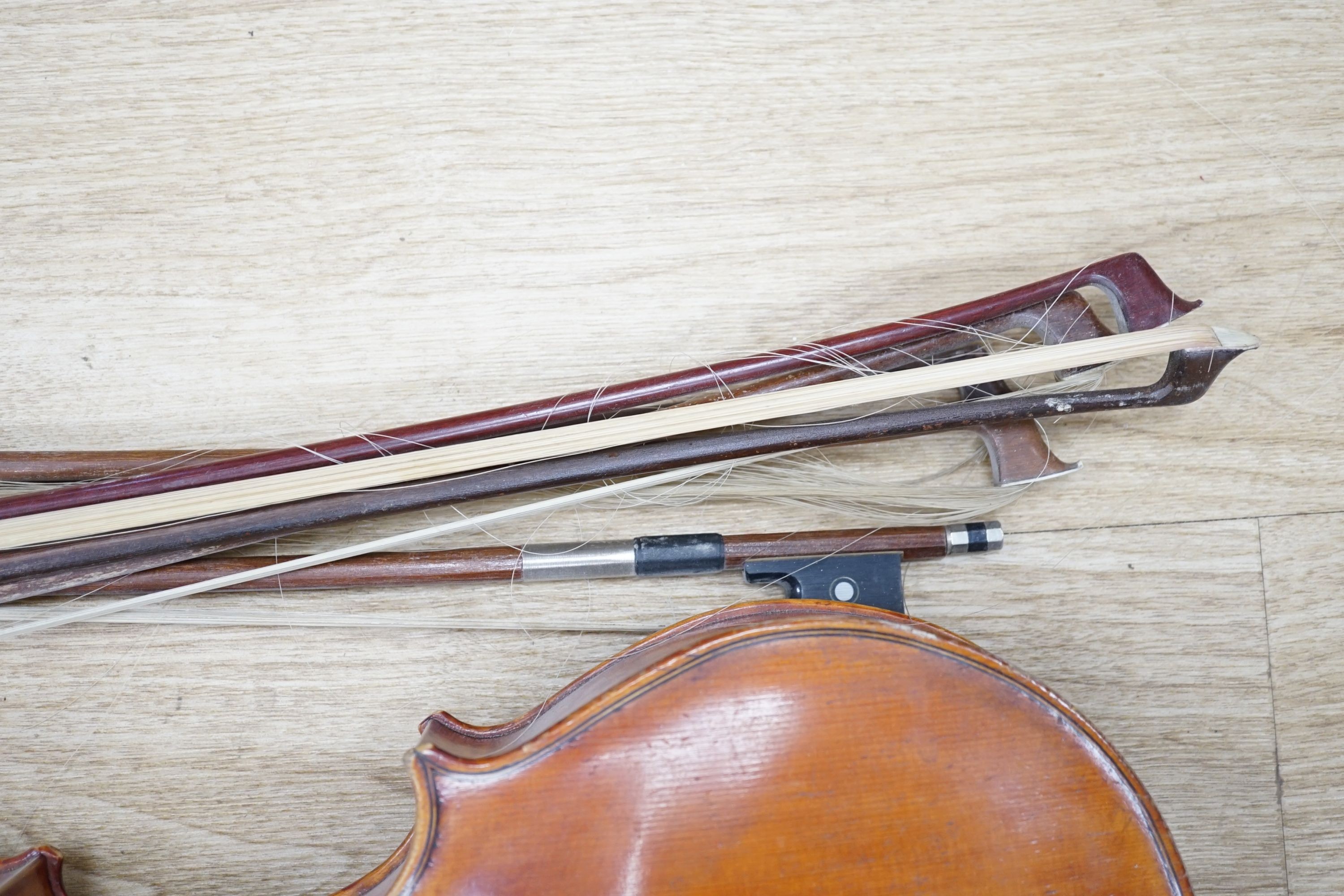 A Viola, assorted bows and a violin back